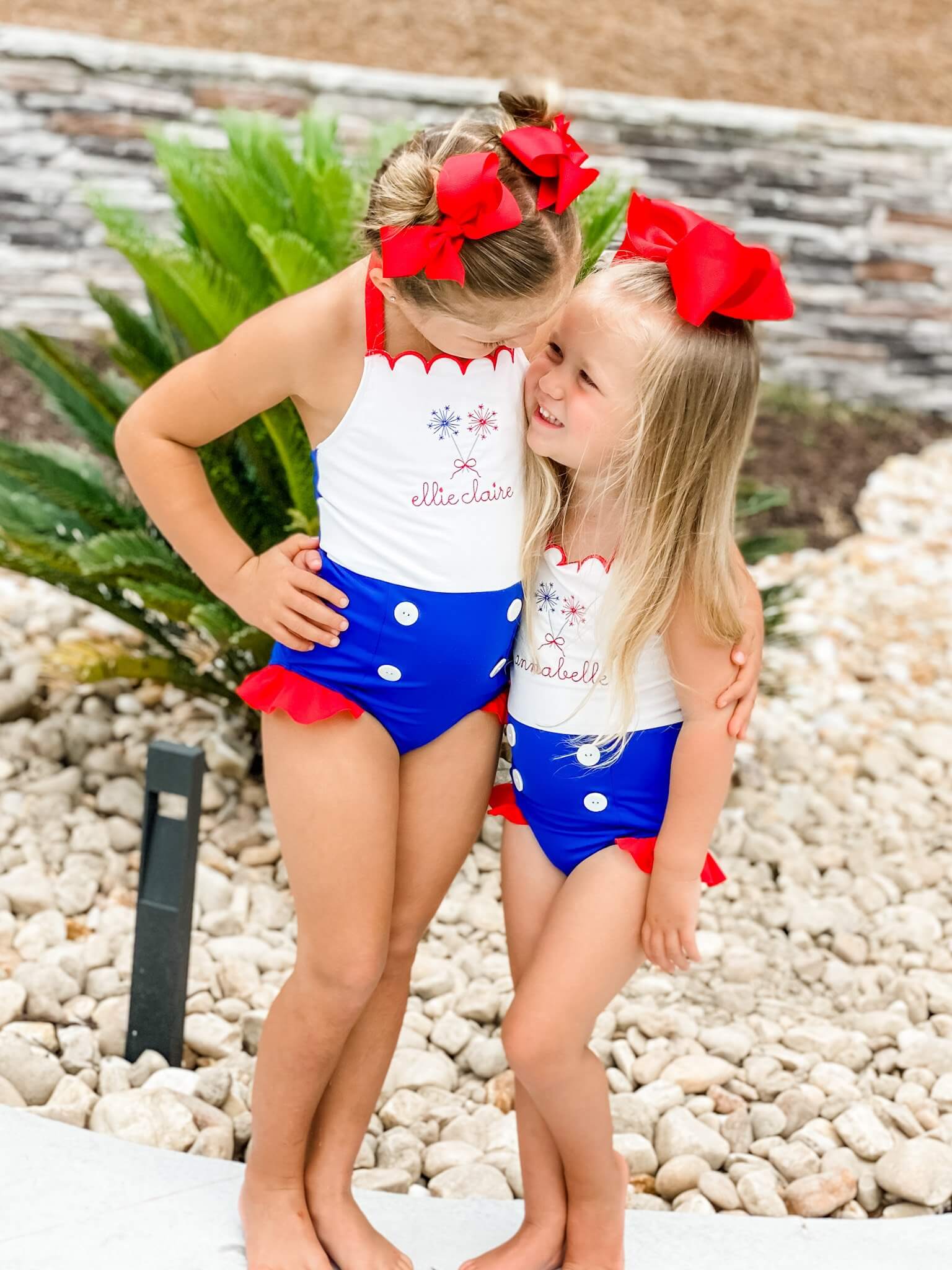 Ellie and Annabelle posing in swimsuits