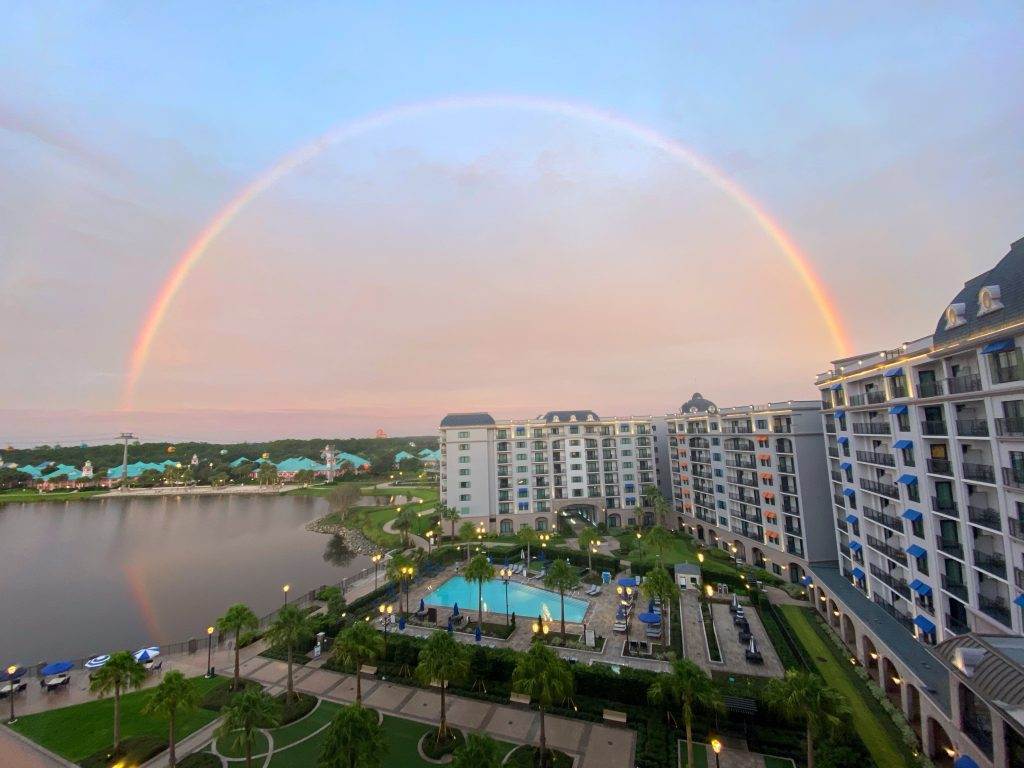 The Disney Riviera resort from the hotel room, with a rainbow in the background.