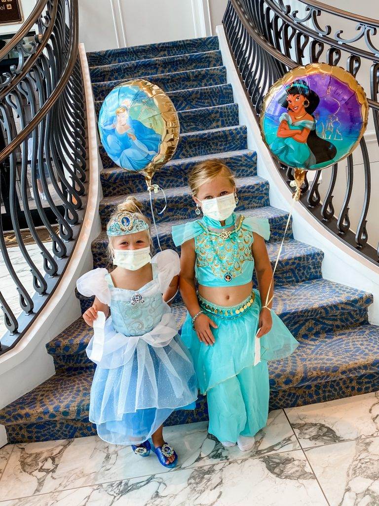 The girls dressed up as Cinderella and Jasmine while at Disney World.