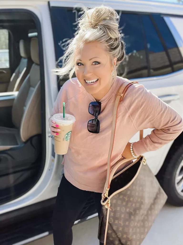 Kristen holding starbucks coffee